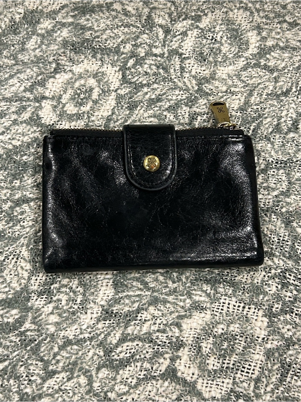 HOBO Black Leather Women's Wallet with Gold Accent.